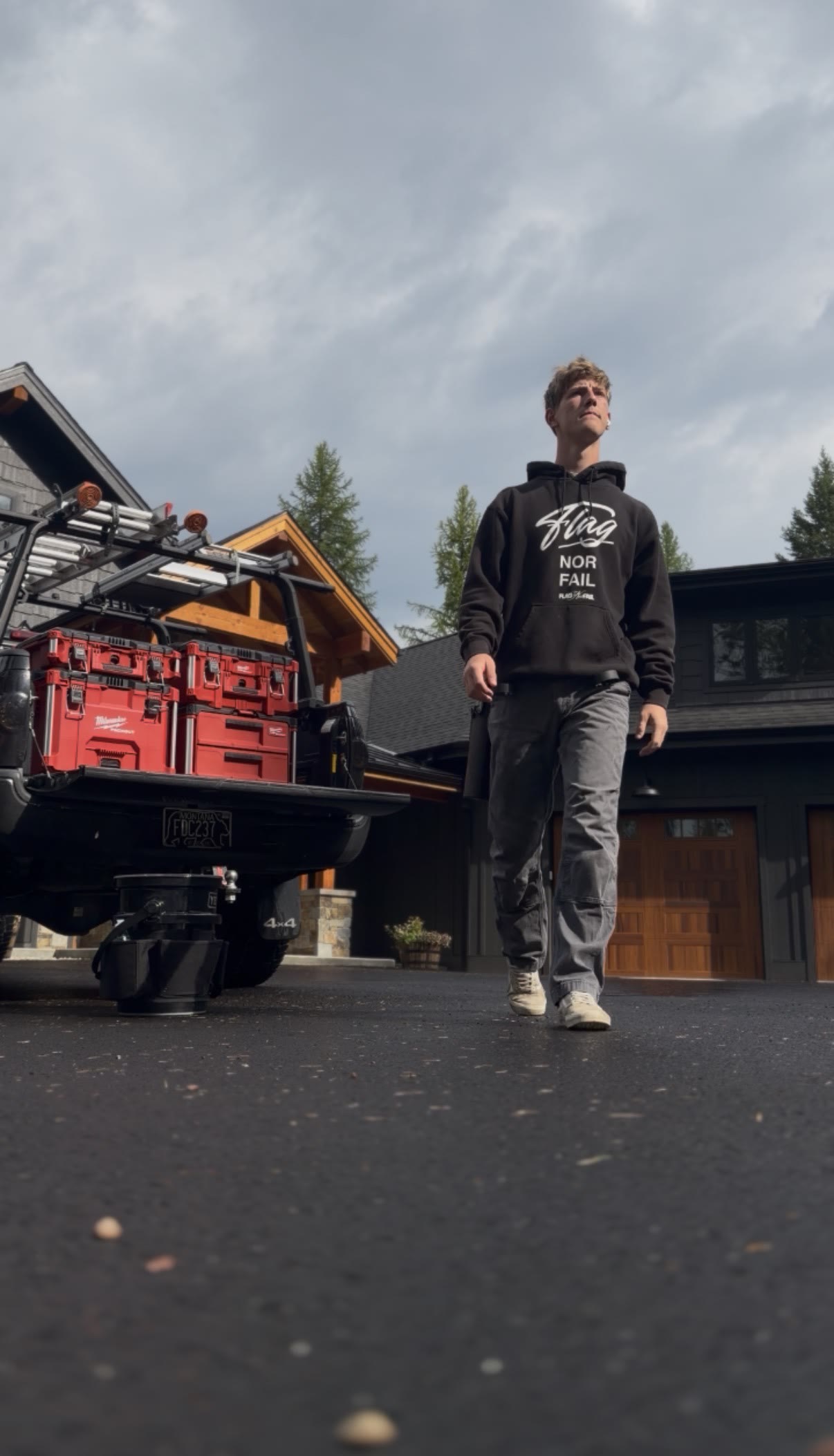 Barrett Teeney, owner of OCS LLC, standing beside his window-cleaning truck